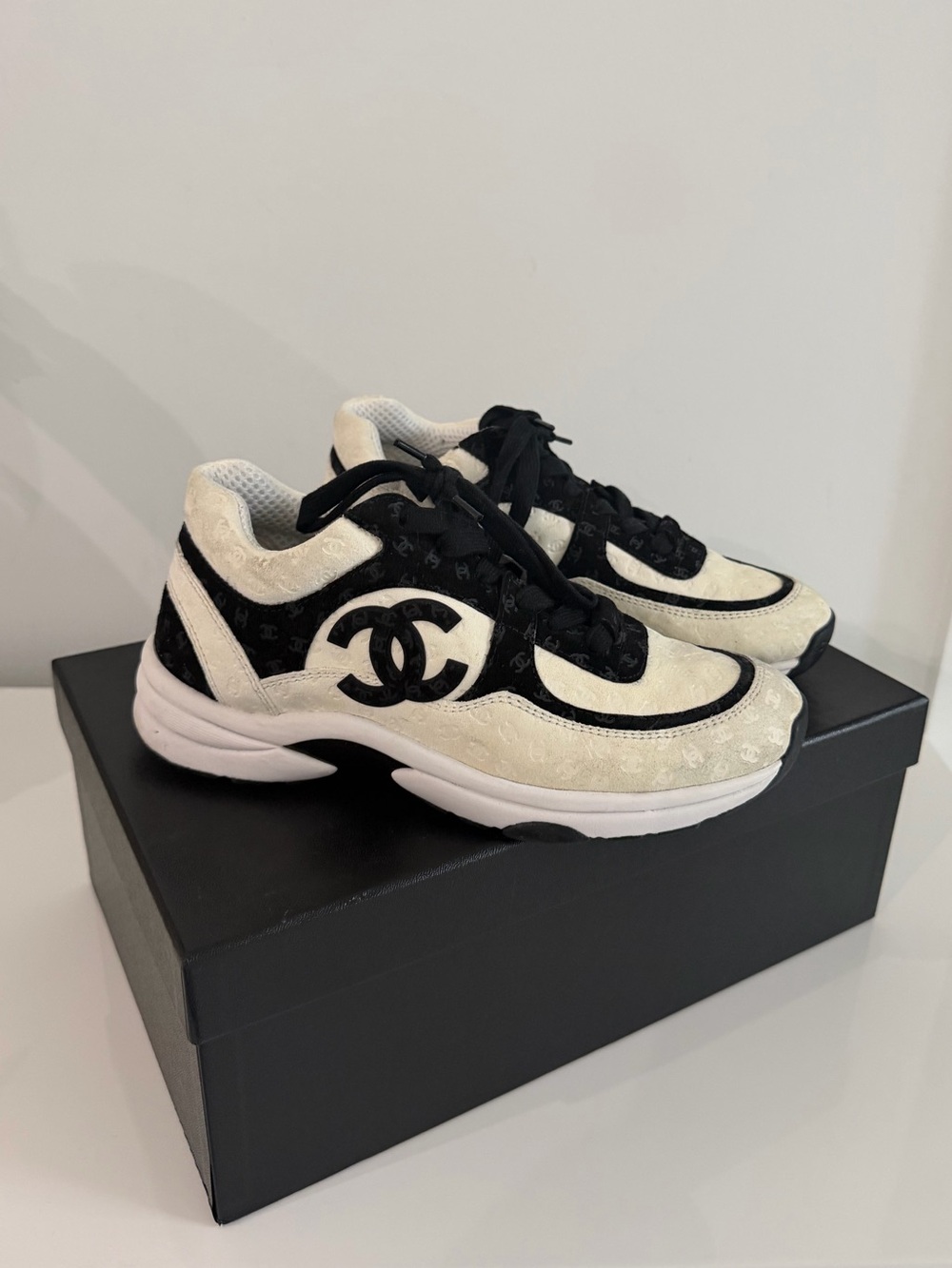 CHANEL Black and White Runner Sneakers with CC Emblem
